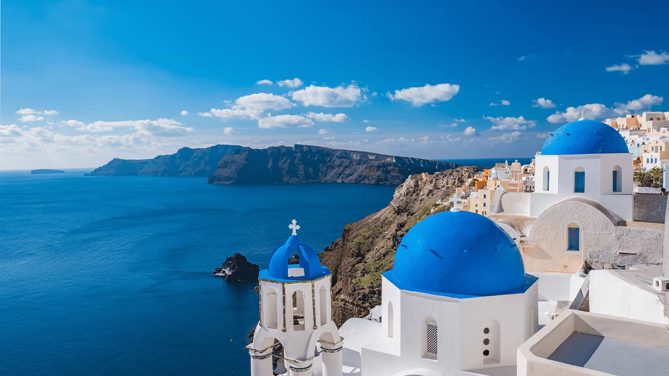 Greece Santorini view of blue domes on the sea background