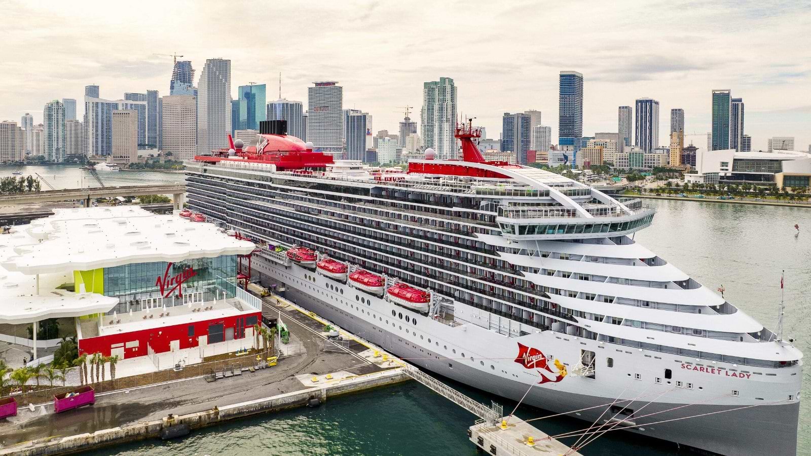 Image of Scarlet Lady at Terminal V-5, sourced from: Virgin Voyages https://cdn1.speedsize.com/eb8d0010-7300-4129-8a6d-74bc221f9caf/https://www.virginvoyages.com/.imaging/desktop/dam/037f4590-5c31-4640-aed6-9aa654bc95fb/Photo/Terminal-V/Scarlet-Lady-at-Terminal-V-5.JPG.JPG