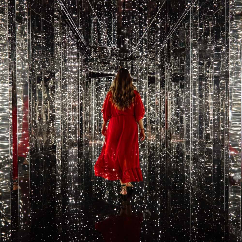 Woman in red dress in the Manor Entrance
