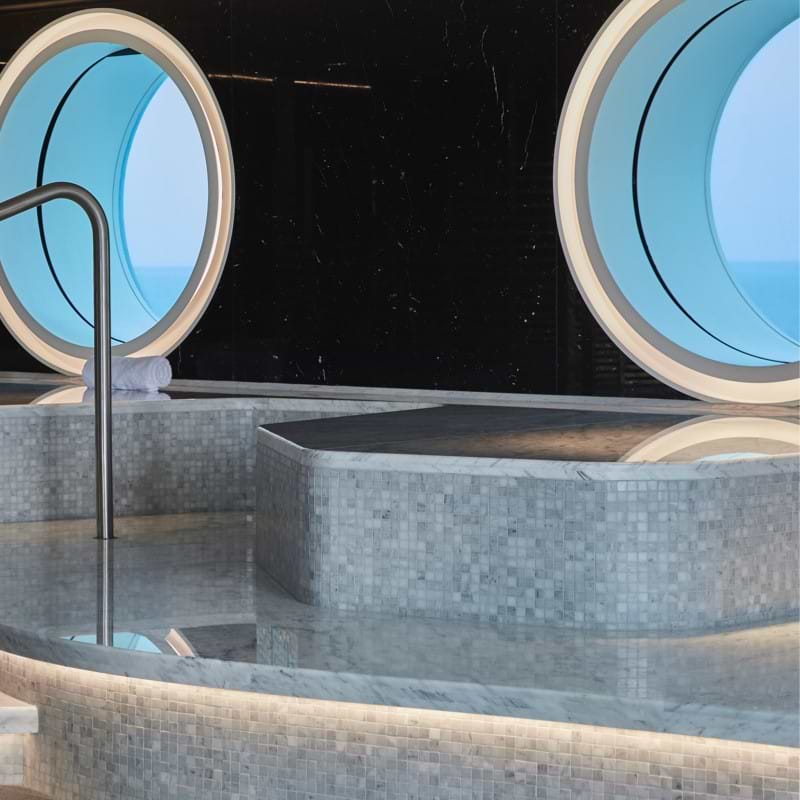 Interior treatment pool at Virgin Voyages' spa experience
